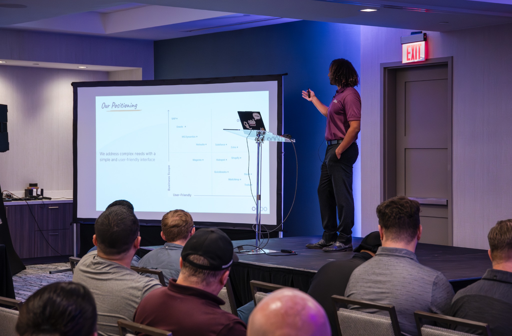 Presenter speaking at the Odoo event