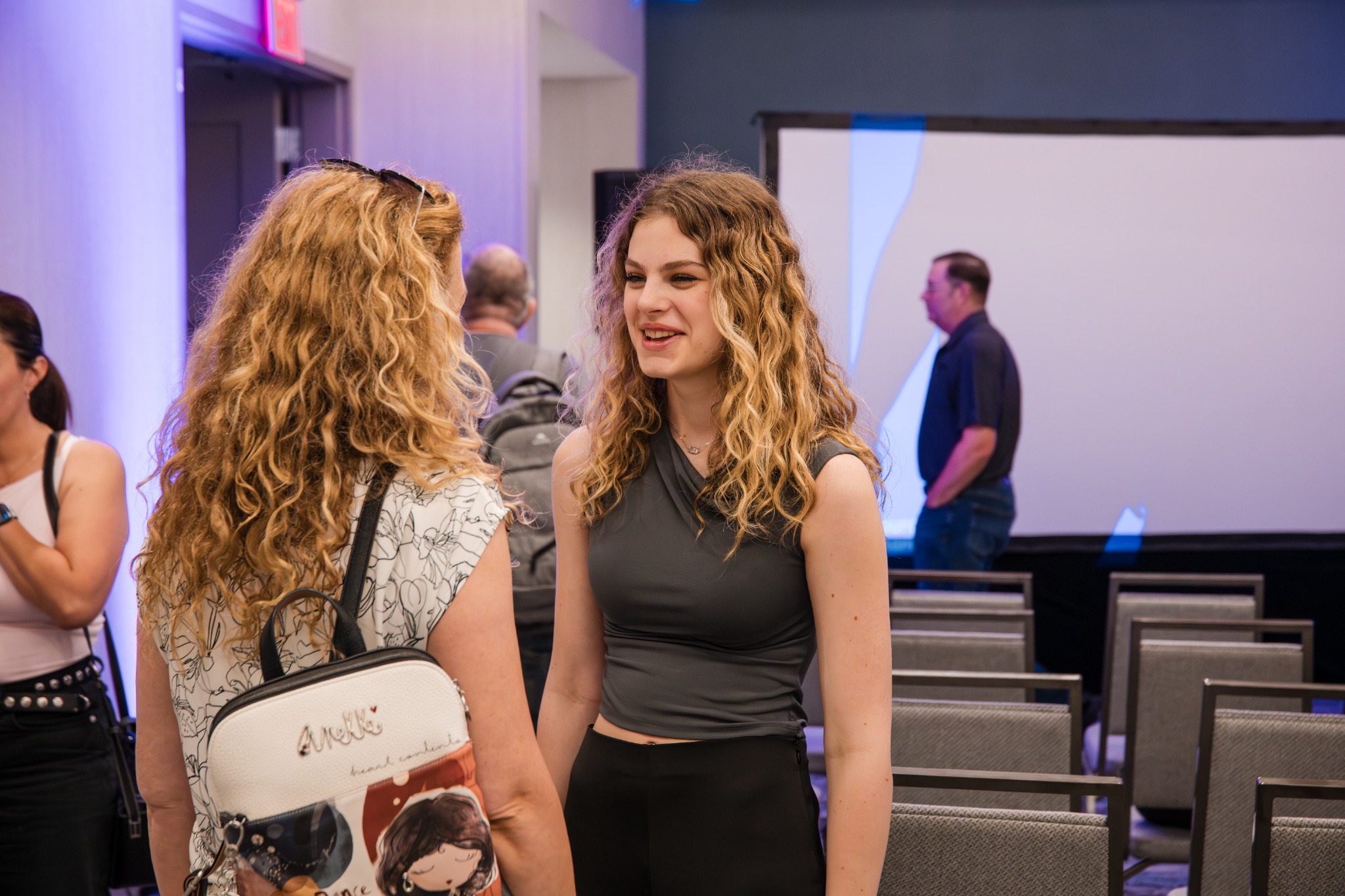 Guests speaking after the presentation