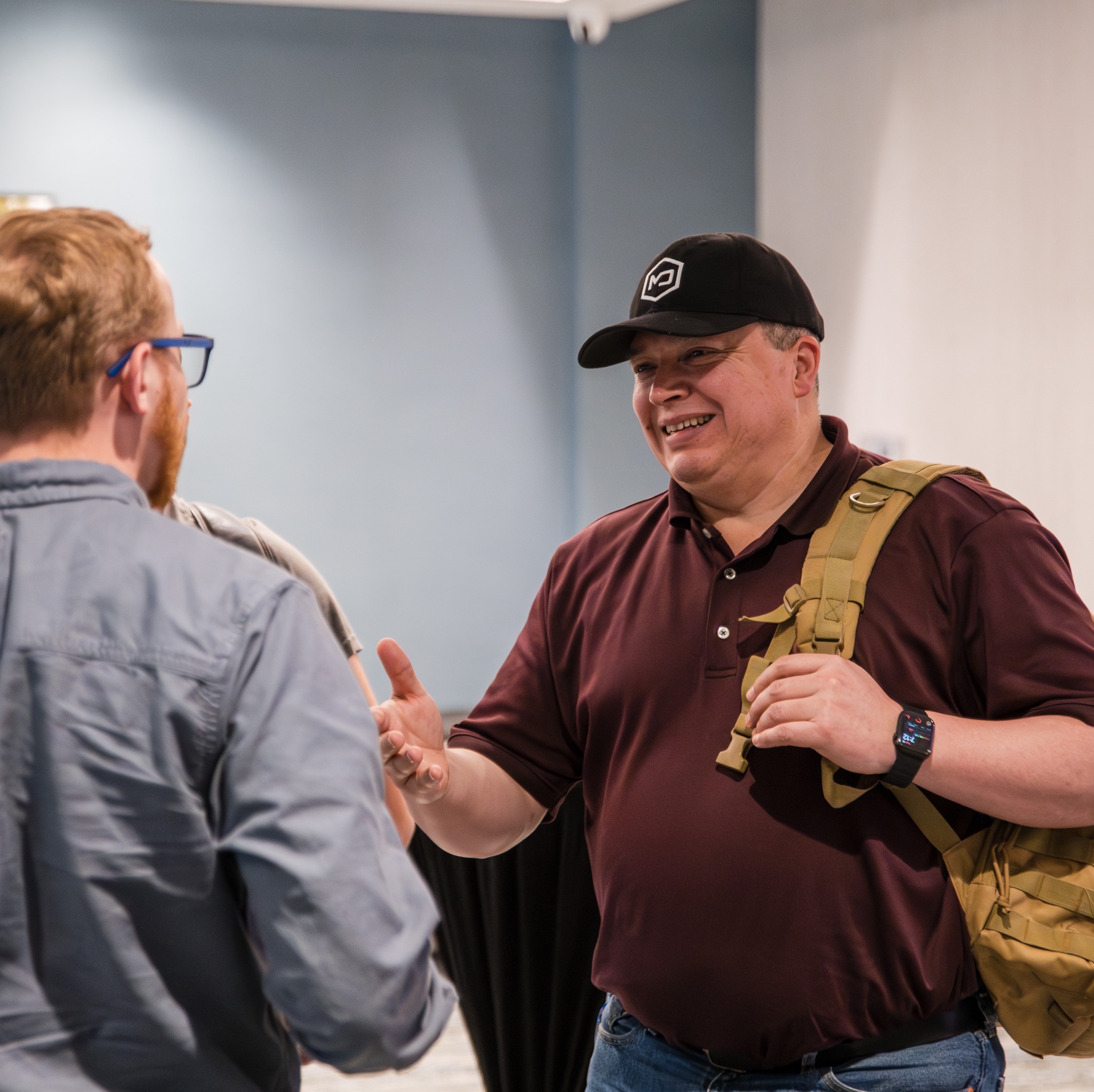 Attendee greeting another guest during networking