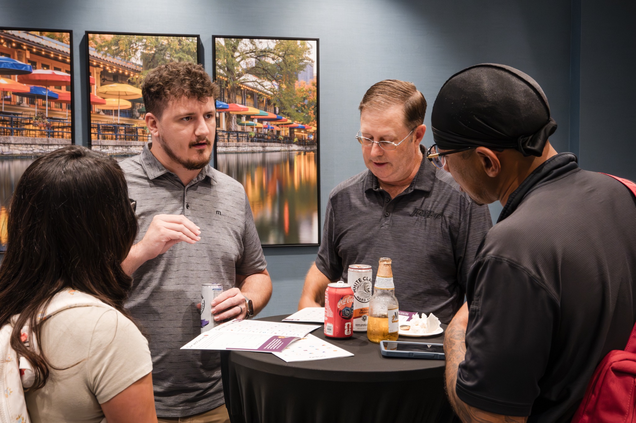 Small group talking around a reception table
