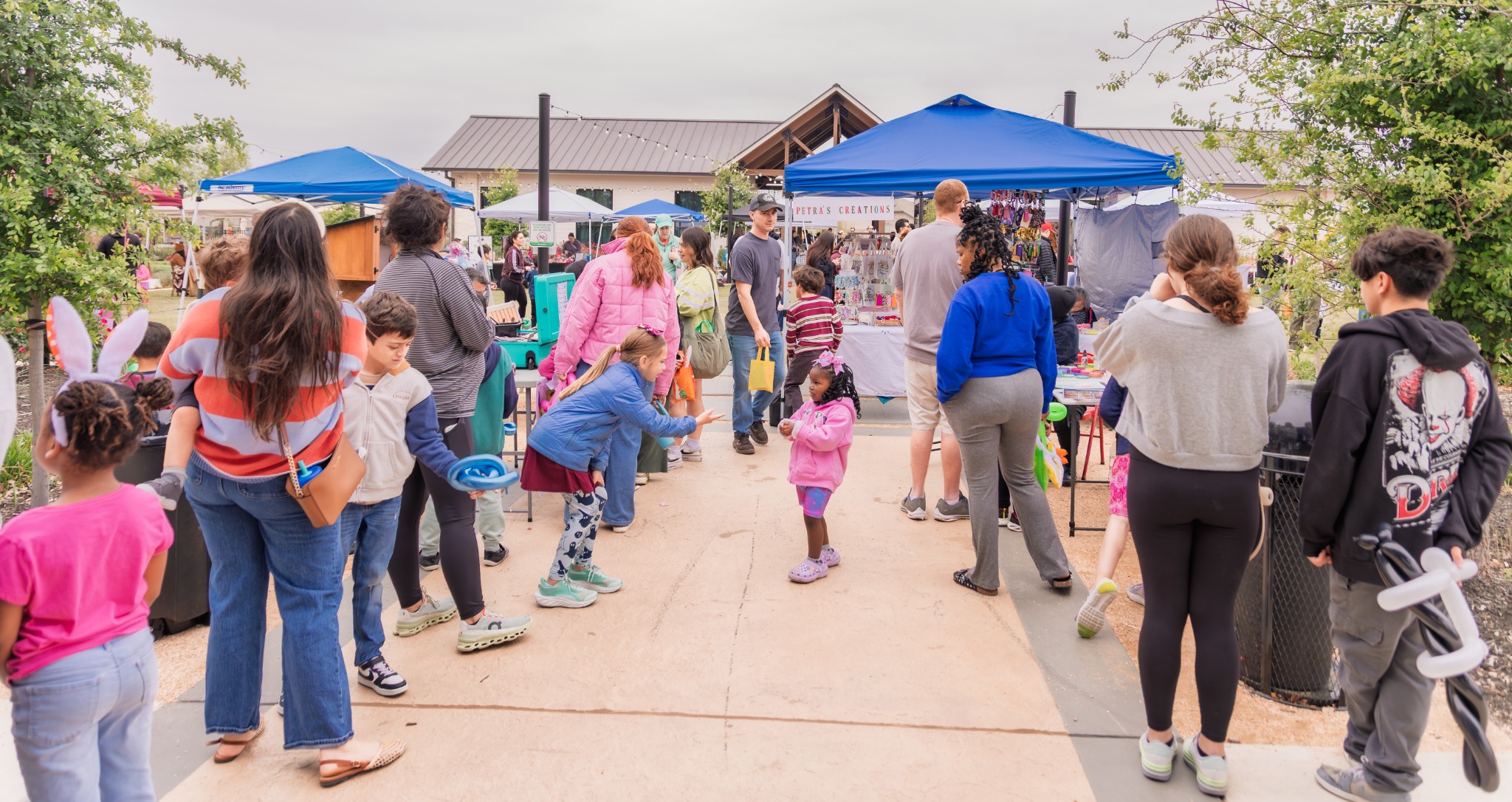 Families and guests walking through the Riverstone vendor event