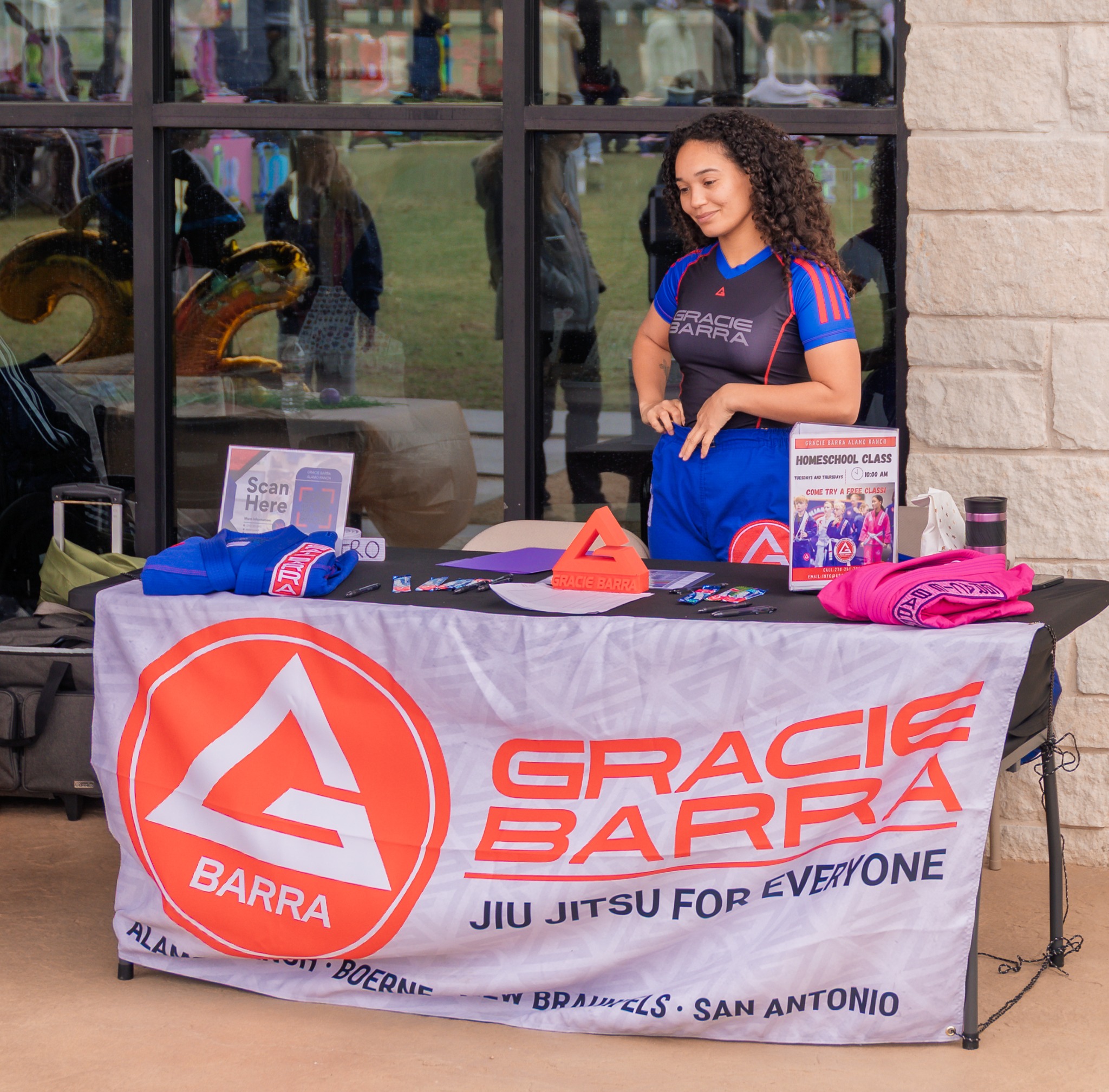 Gracie Barra representative at a branded vendor display