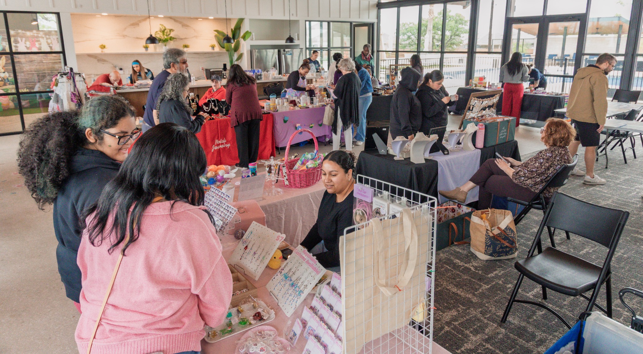 Wide view of guests and vendors interacting inside the event
