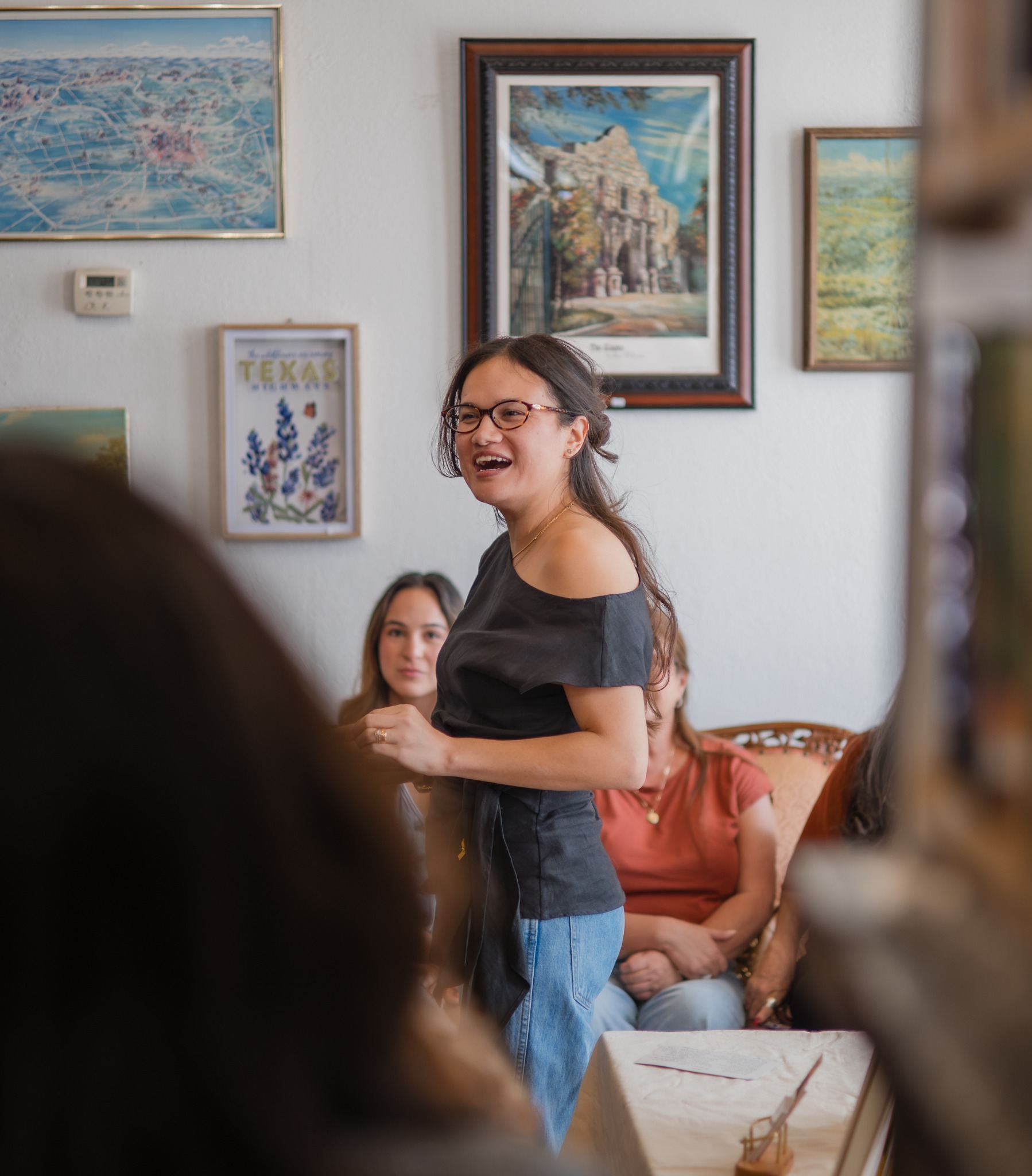 Renée S. Tijerina speaking and laughing during the author signing