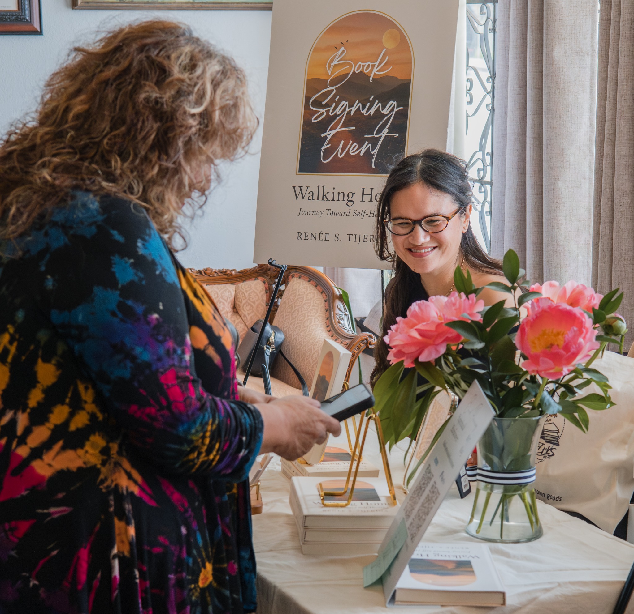 Guest interaction at the Walking Home signing table