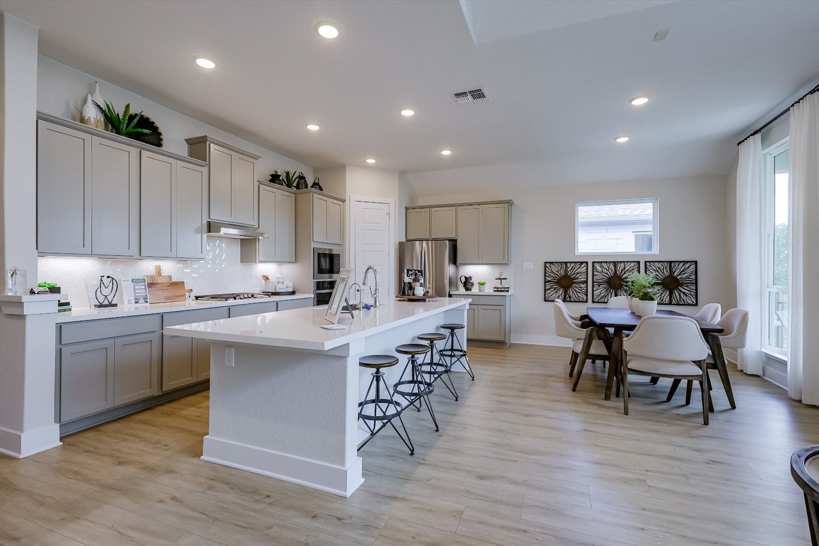 Bright open-concept kitchen with island and dining area