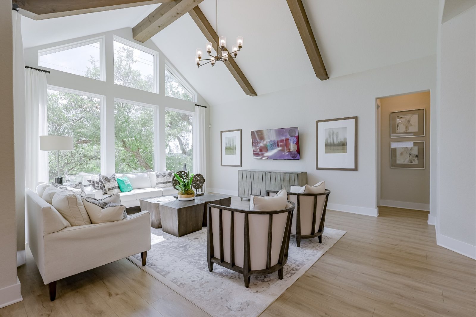 Living room with vaulted ceiling and wood beams