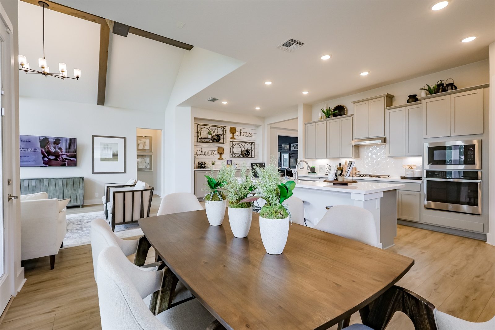 Dining room with wood table and greenery centerpiece