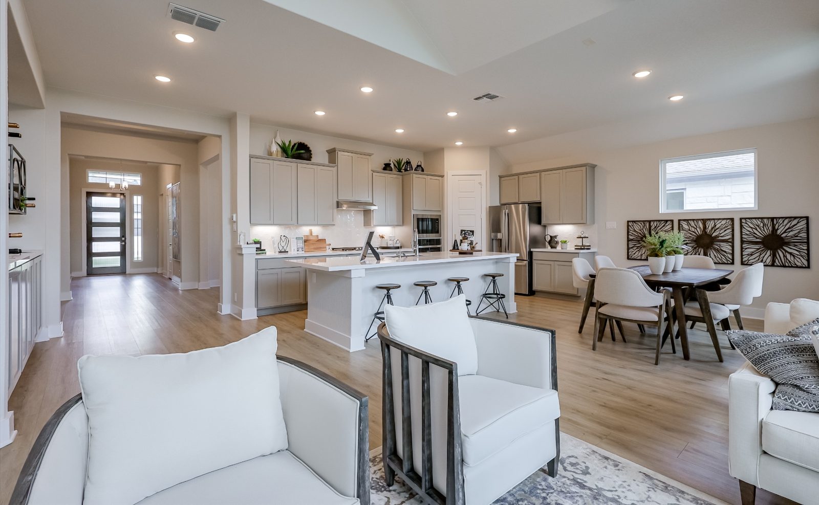 Open living and dining area with entry view