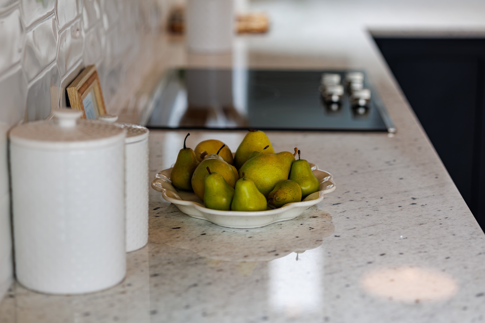Bowl of pears on a kitchen countertop