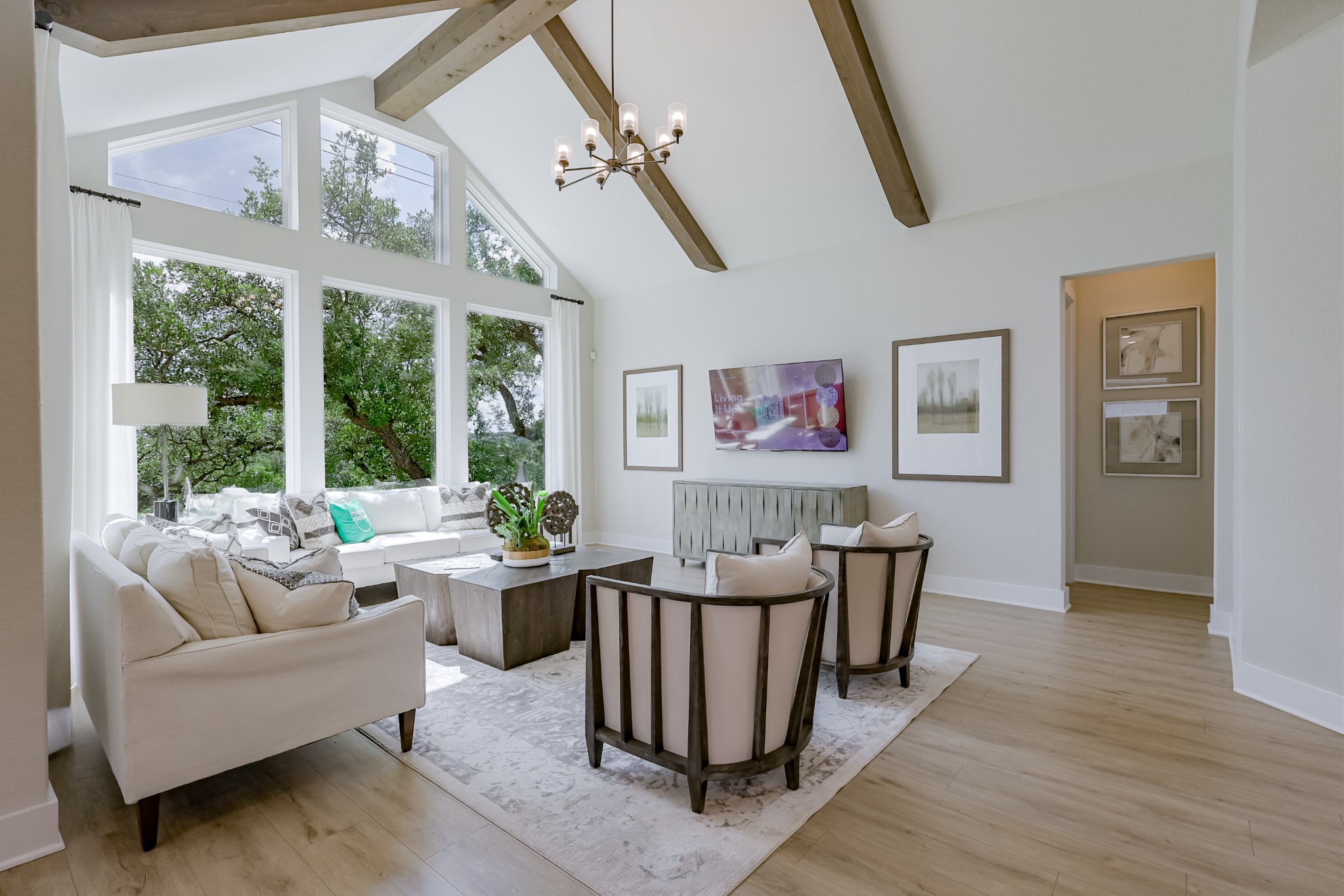 Living room with vaulted ceiling and wood beams